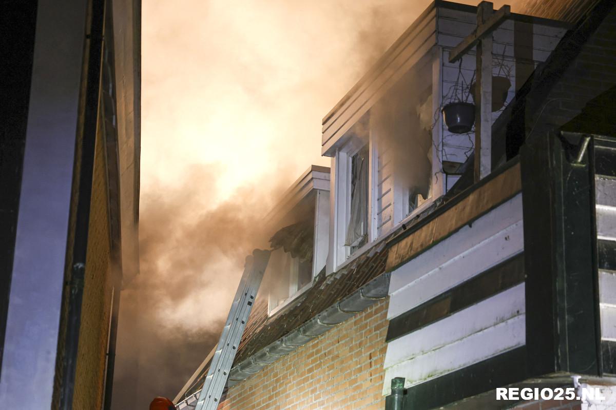 Hardnekkige brand in woning en pizzeria