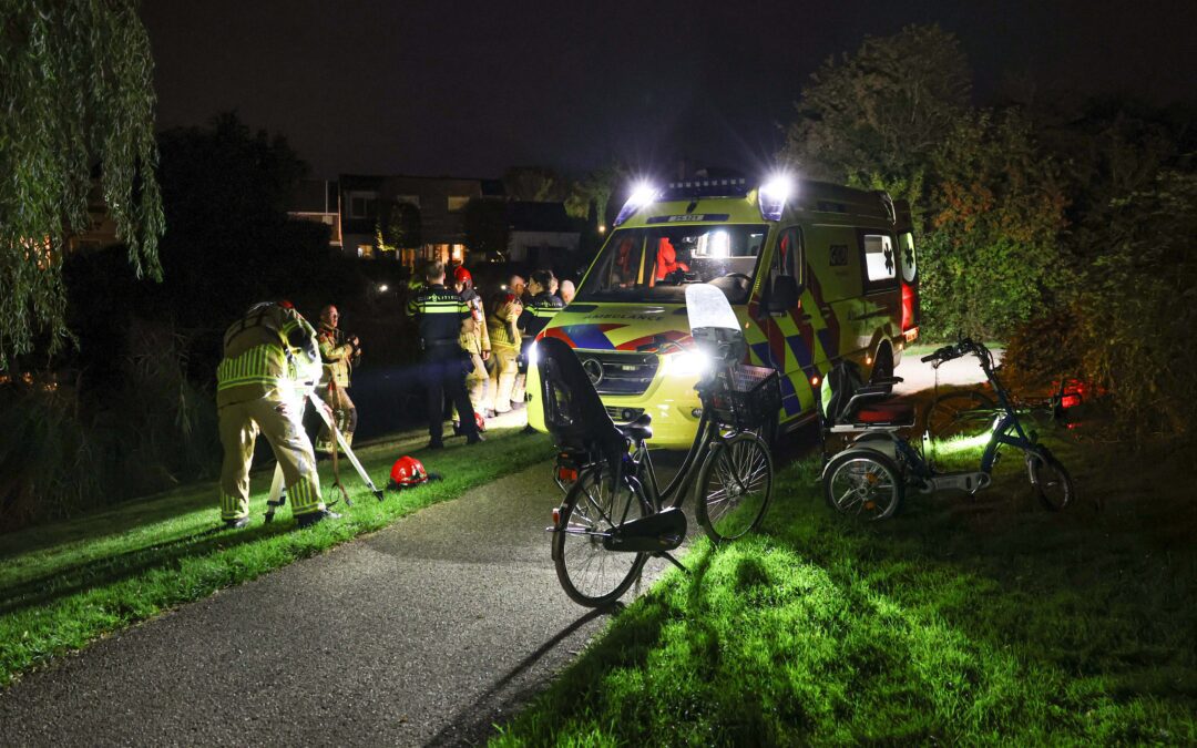 Man met driewieler te water in De Erven